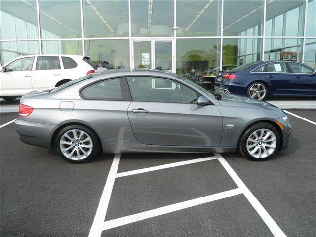 2009 BMW 3 series 2011 Chevrolet LT