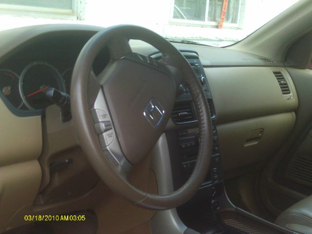 2006 Honda Pilot 2010 Cadillac CTS