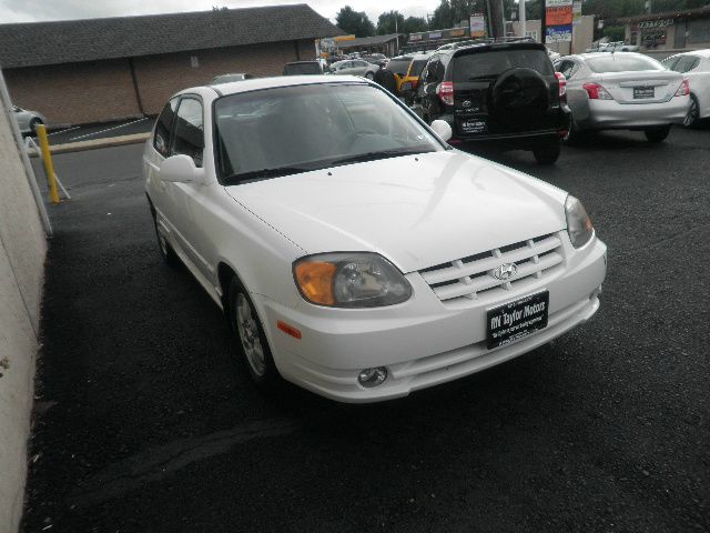 2003 Hyundai Accent 2000 Dodge SLT