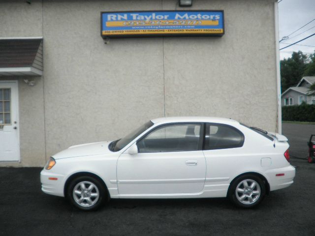 2003 Hyundai Accent 2000 Dodge SLT