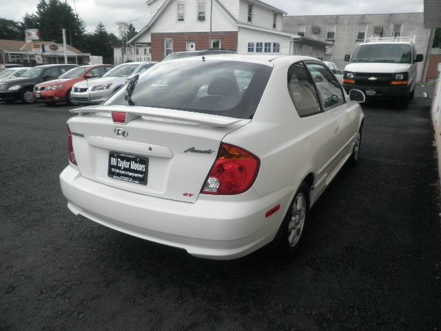 2003 Hyundai Accent 2000 Dodge SLT