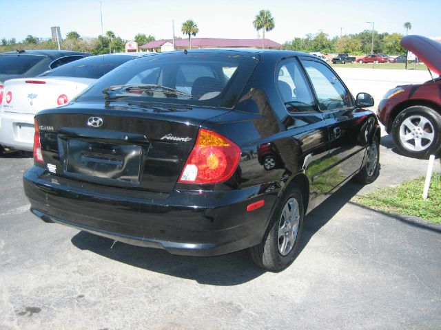 2003 Hyundai Accent 2000 Dodge SLT