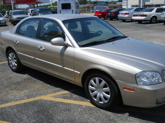 2006 Kia Optima 1998 Jaguar 8