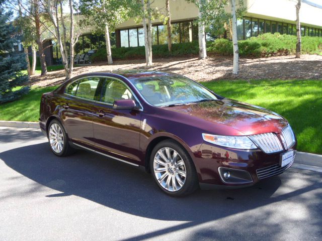 2011 Lincoln MKS 2007 Mazda Mazda3 S Sport