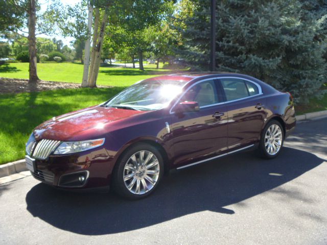 2011 Lincoln MKS 2007 Mazda Mazda3 S Sport