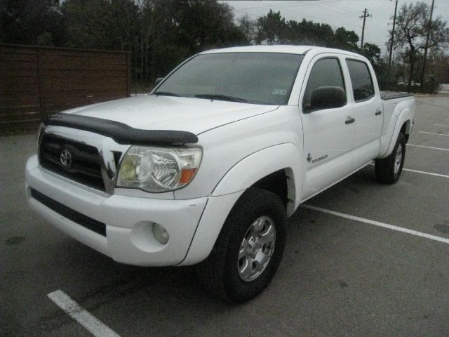 2005 Toyota Tacoma 2011 Kia SX