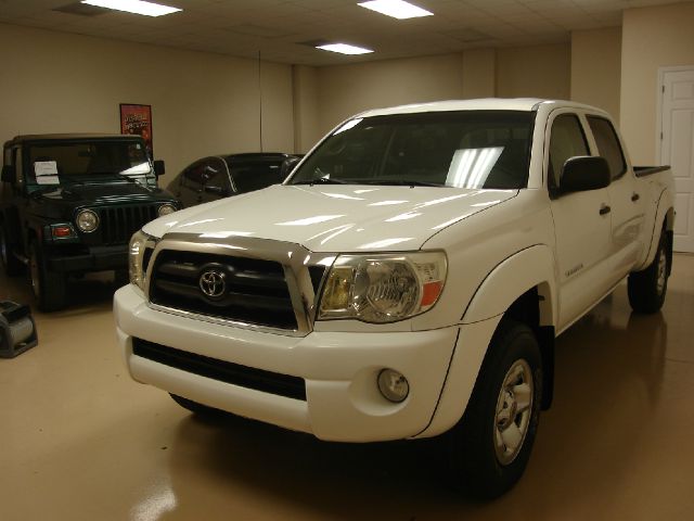 2005 Toyota Tacoma 2011 Kia SX