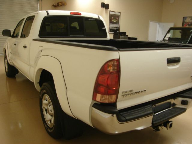 2005 Toyota Tacoma 2011 Kia SX