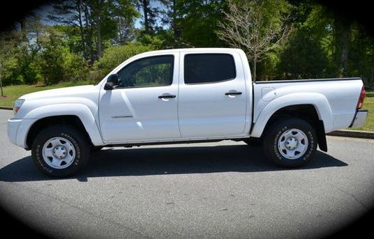 2006 Toyota Tacoma 2011 Kia SX