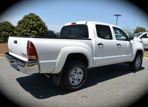 2006 Toyota Tacoma 2011 Kia SX