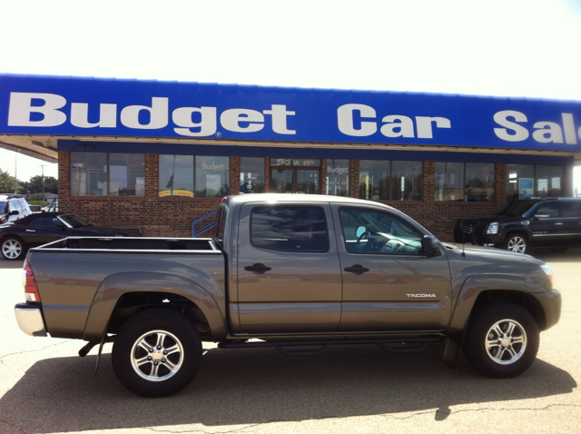 2011 Toyota Tacoma 2011 Kia SX