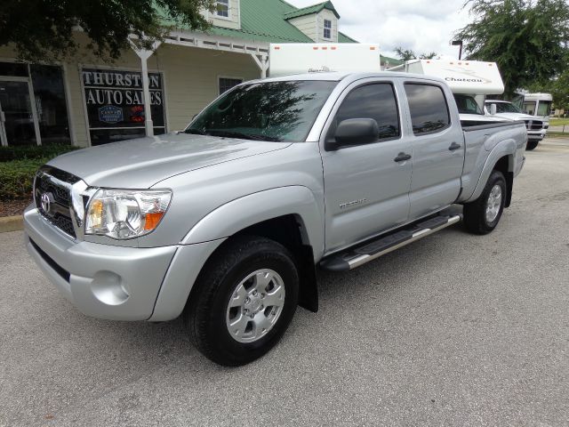 2011 Toyota Tacoma 2011 Kia SX