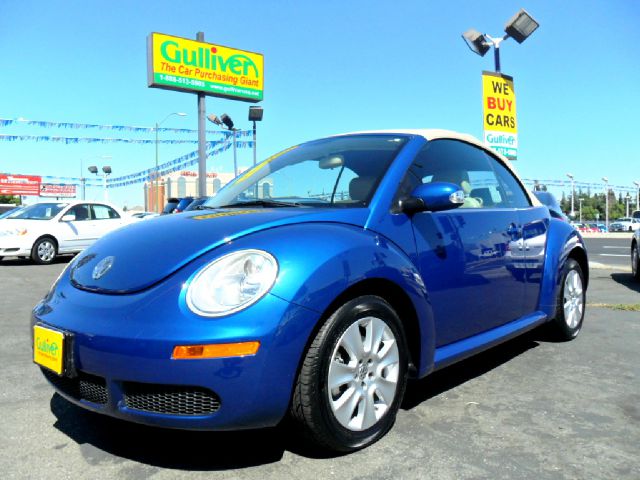 2008 Volkswagen New Beetle 2003 Toyota Sport