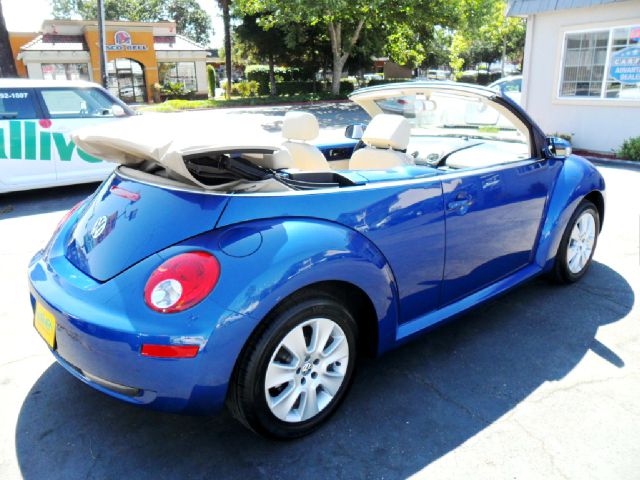 2008 Volkswagen New Beetle 2003 Toyota Sport