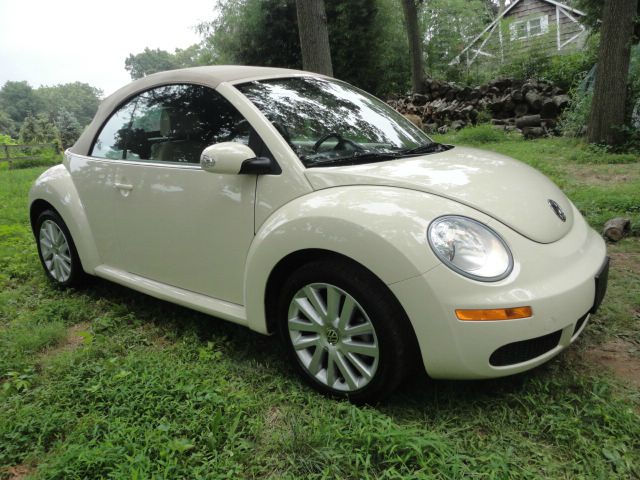 2009 Volkswagen New Beetle 2003 Toyota Sport