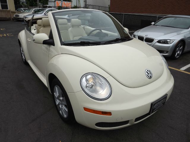 2009 Volkswagen New Beetle 2003 Toyota Sport