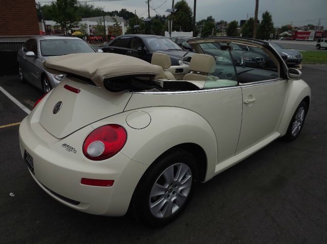 2009 Volkswagen New Beetle 2003 Toyota Sport