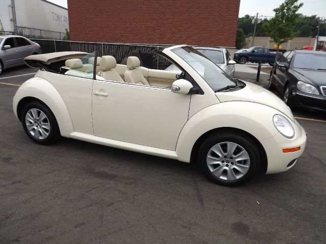 2009 Volkswagen New Beetle 2003 Toyota Sport