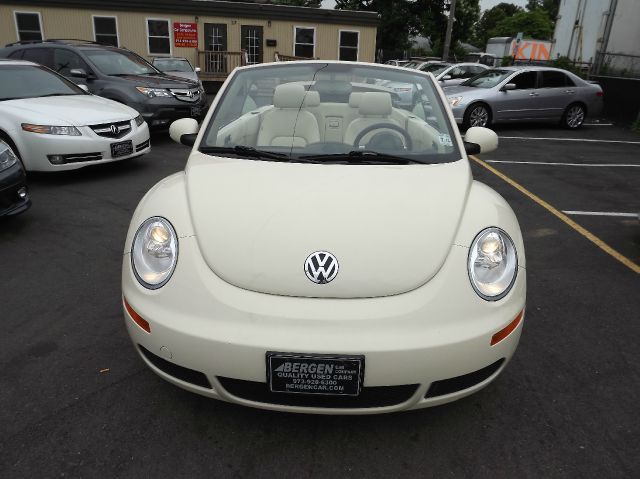 2009 Volkswagen New Beetle 2003 Toyota Sport