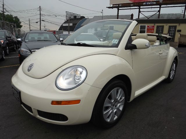 2009 Volkswagen New Beetle 2003 Toyota Sport