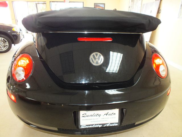 2009 Volkswagen New Beetle 2003 Toyota Sport