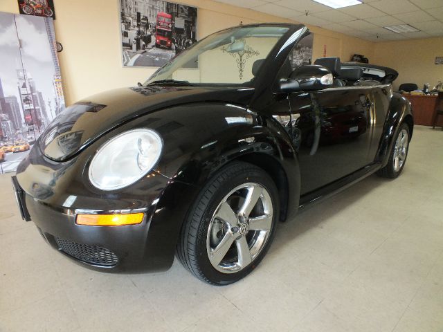 2009 Volkswagen New Beetle 2003 Toyota Sport