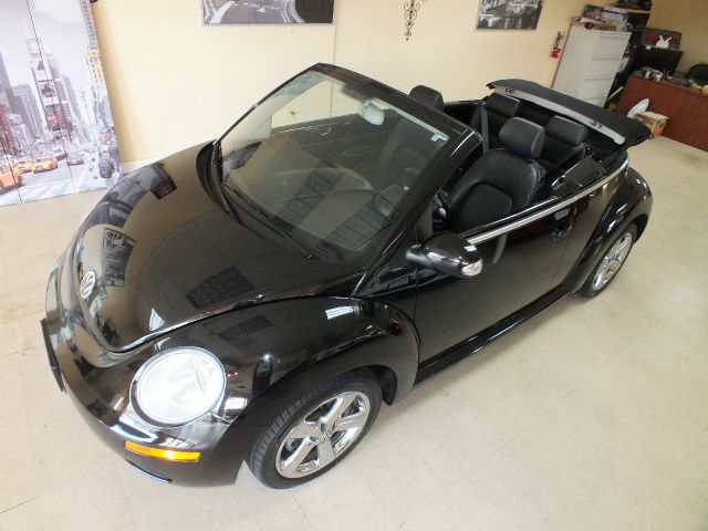 2009 Volkswagen New Beetle 2003 Toyota Sport