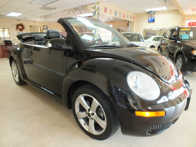 2009 Volkswagen New Beetle 2003 Toyota Sport